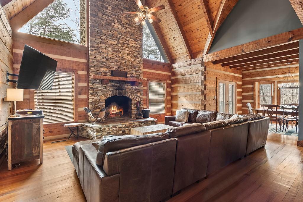 192 Grassy Knob Court Jasper, GA 30143 - Photo 14 of 88 a living room with furniture a fireplace and a flat screen tv