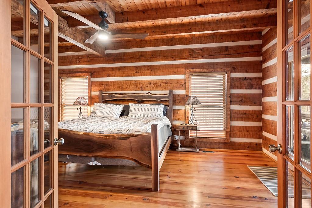 192 Grassy Knob Court Jasper, GA 30143 - Photo 20 of 88 a bedroom with a bed and wooden floor