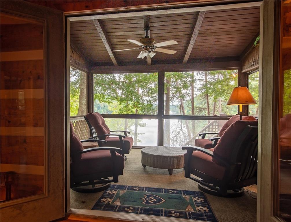 192 Grassy Knob Court Jasper, GA 30143 - Photo 28 of 88 a living room with furniture and a floor to ceiling window