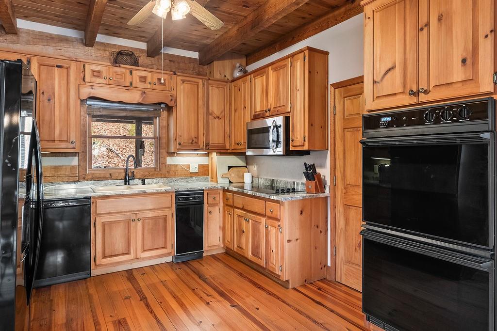 192 Grassy Knob Court Jasper, GA 30143 - Photo 34 of 88 a kitchen with stainless steel appliances granite countertop a stove a sink and a refrigerator