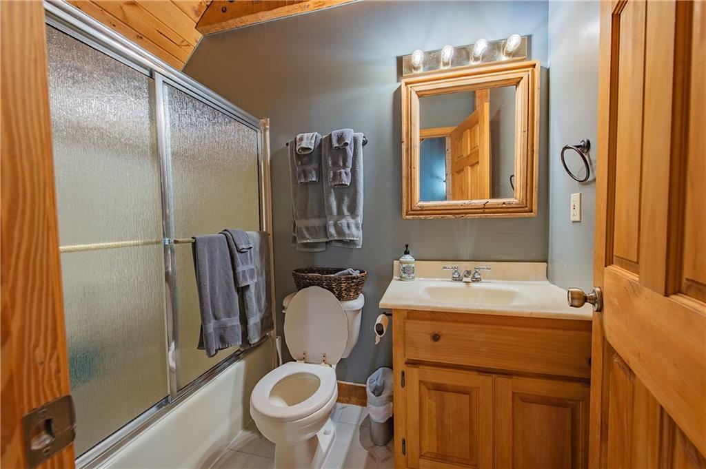 192 Grassy Knob Court Jasper, GA 30143 - Photo 36 of 88 a bathroom with a sink toilet and mirror