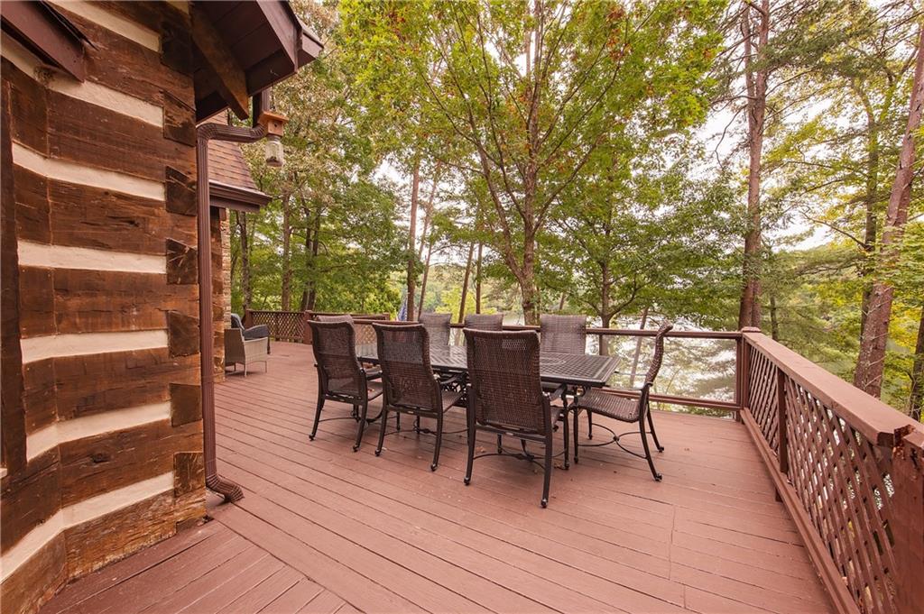 192 Grassy Knob Court Jasper, GA 30143 - Photo 41 of 88 a view of a roof deck with table and chairs and couches