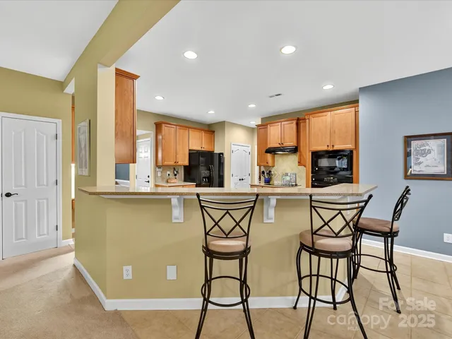 a view of a dining room with furniture and a window