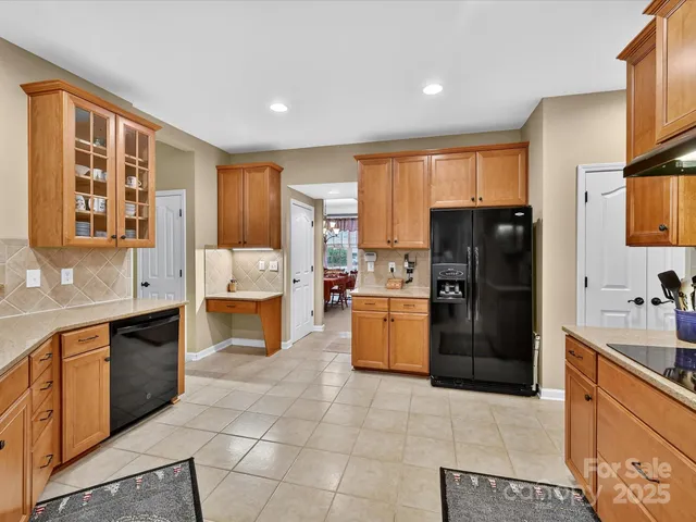 a kitchen with a refrigerator and a sink