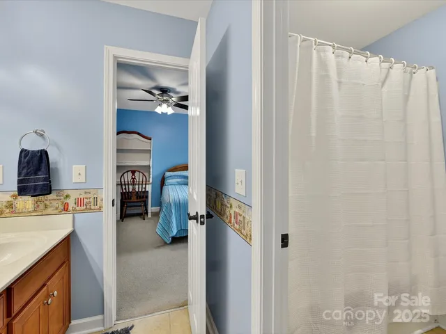 a view of utility room and bathroom