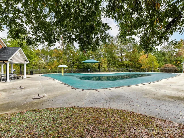 a view of house with a yard