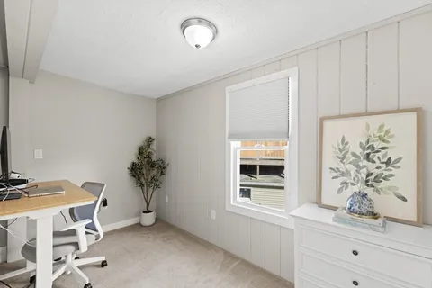 a view of workspace with furniture and potted plant