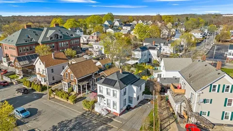 an aerial view of residential houses with outdoor space