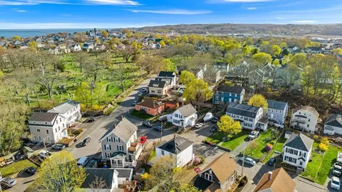 an aerial view of residential building with parking