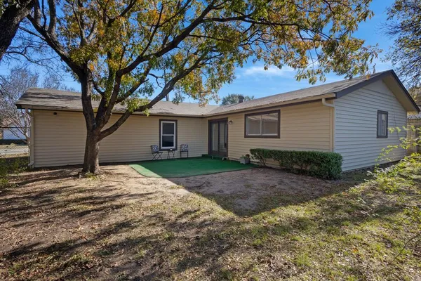 a house with a tree in front of it