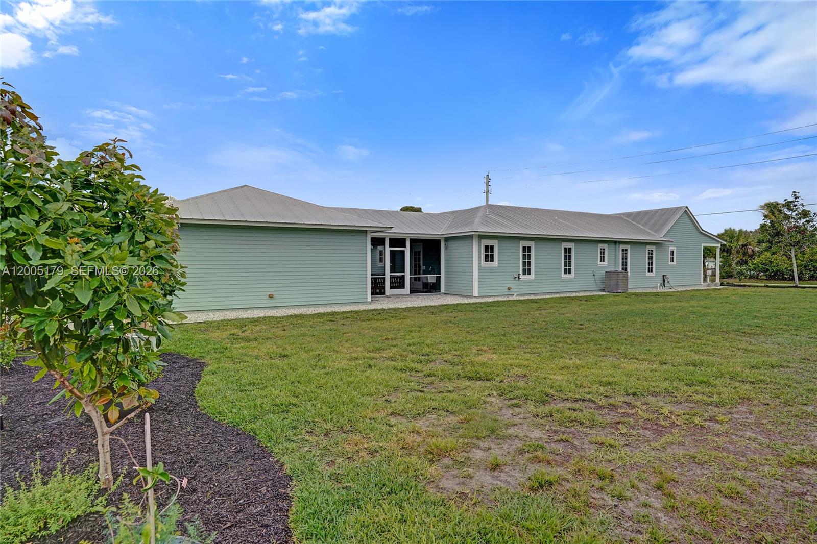 4648 Southeast Binnacle Way Stuart, FL 34997 - Photo 62 of 80 Extra lot view to side of house