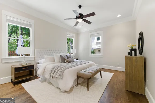 a bedroom with a large bed and a window