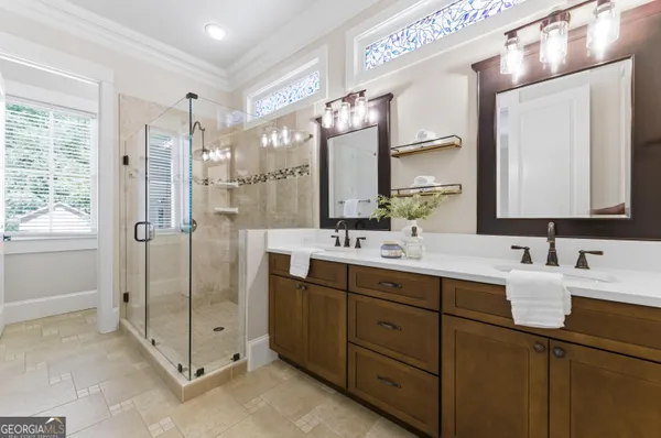 a bathroom with a double vanity sink mirror and double