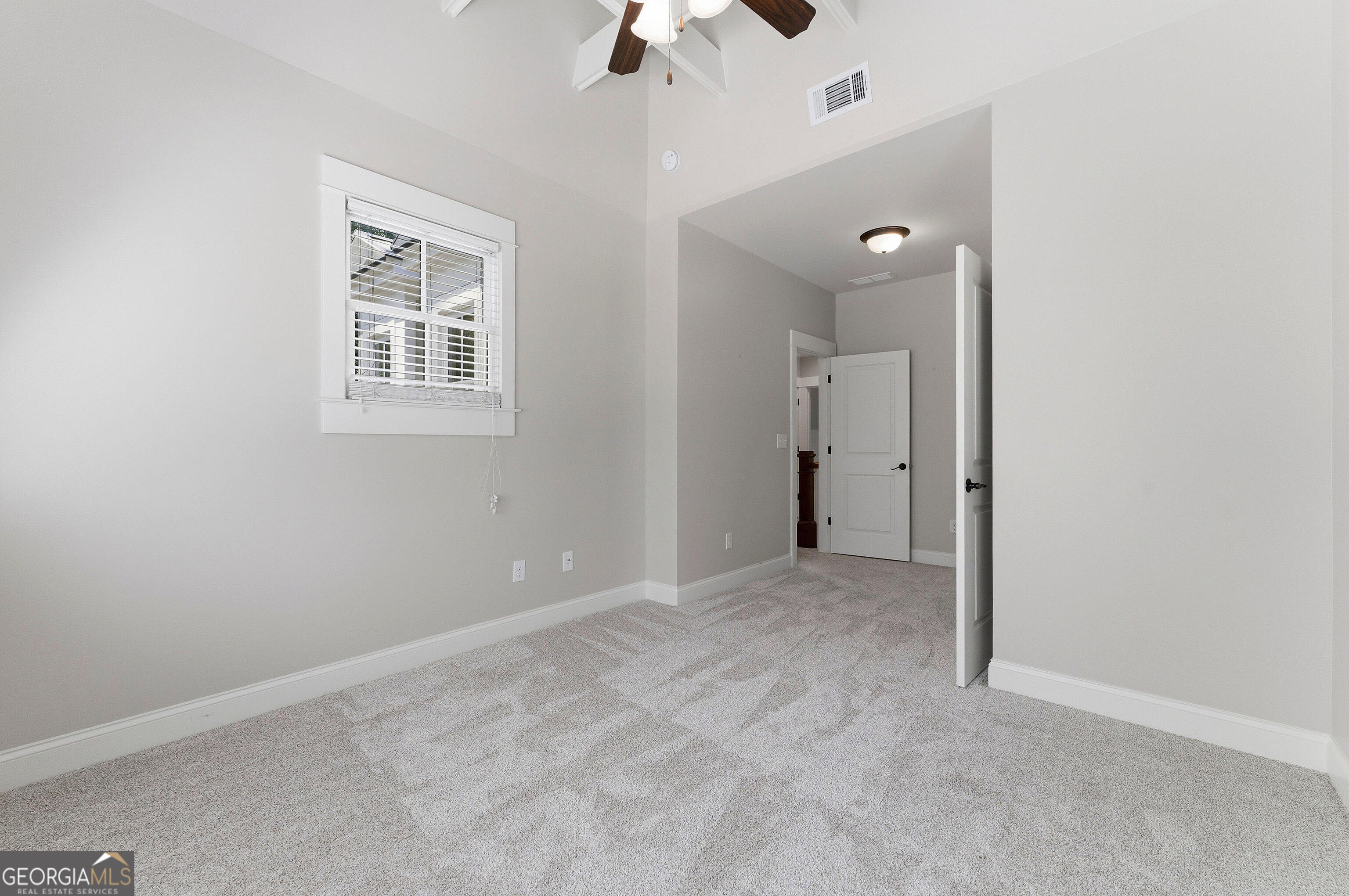 104 Fairview Street Decatur, GA 30030 - Photo 24 of 39 an empty room with a chandelier fan and windows