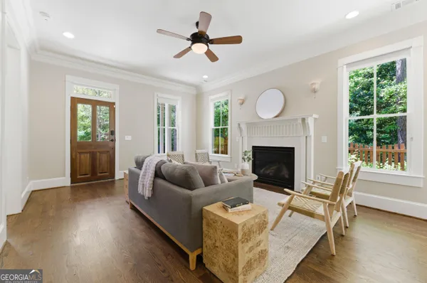 a living room with furniture and a fireplace