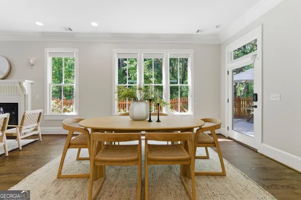 a view of a dining room with furniture window and wooden floor