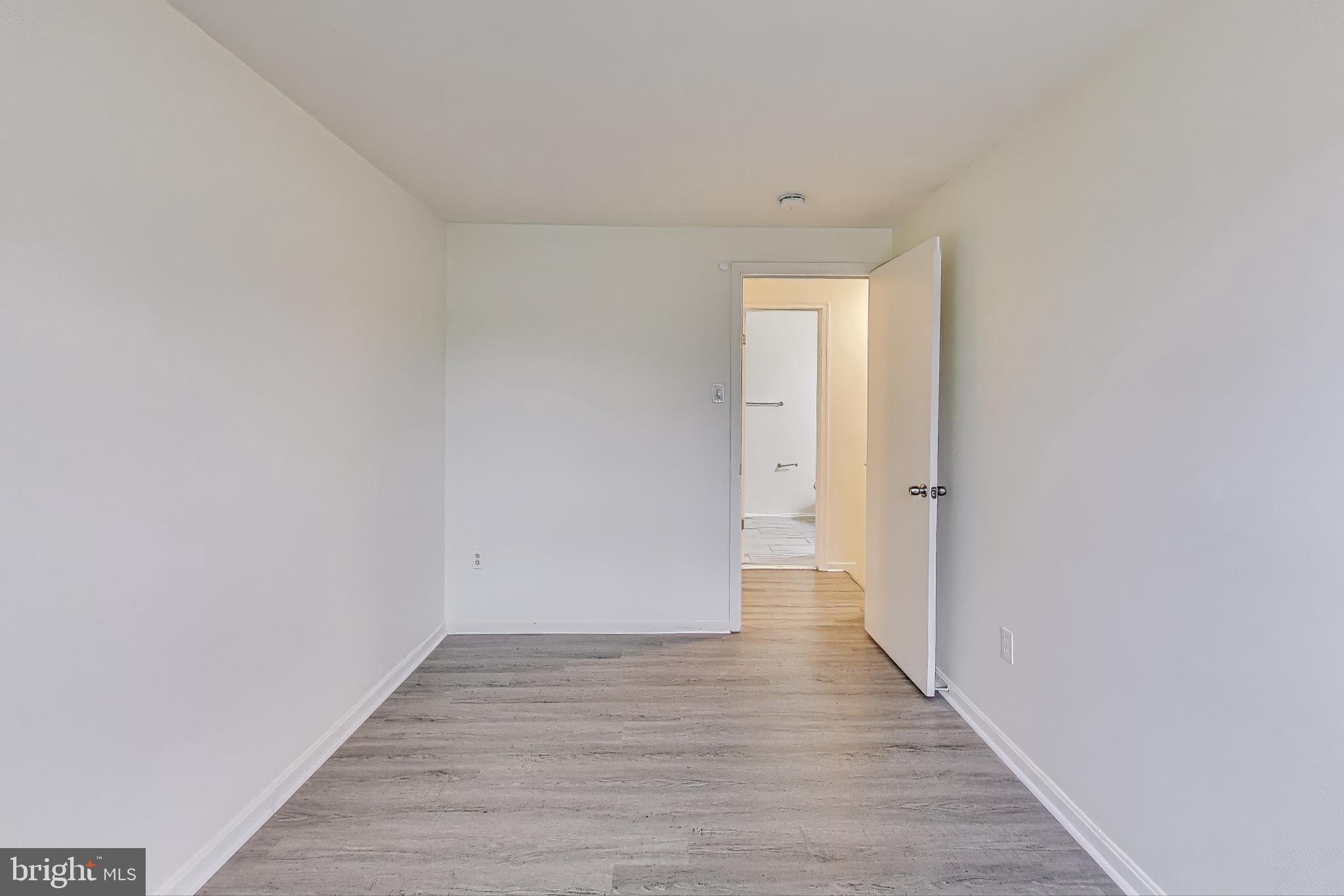 16 Tabiona Court Silver Spring, MD 20906 - Photo 18 of 34 a view of an empty room with wooden floor