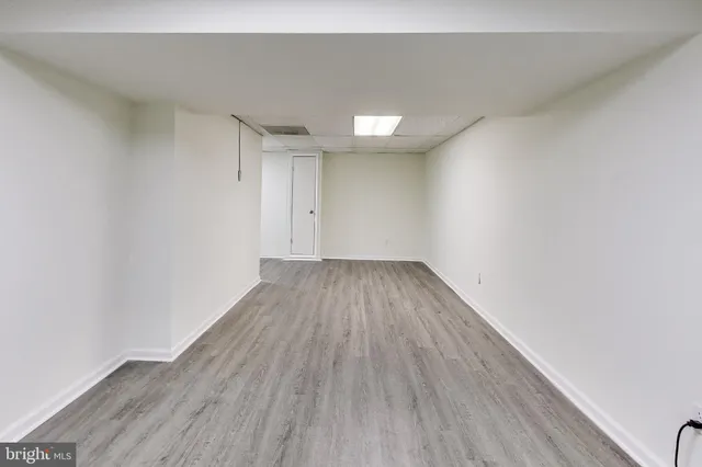 a view of room with wooden floor