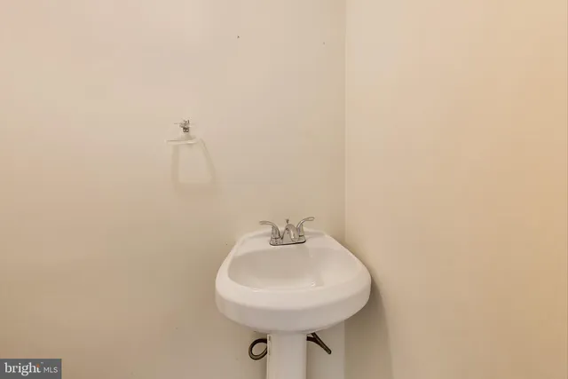a bathroom with a sink and mirror