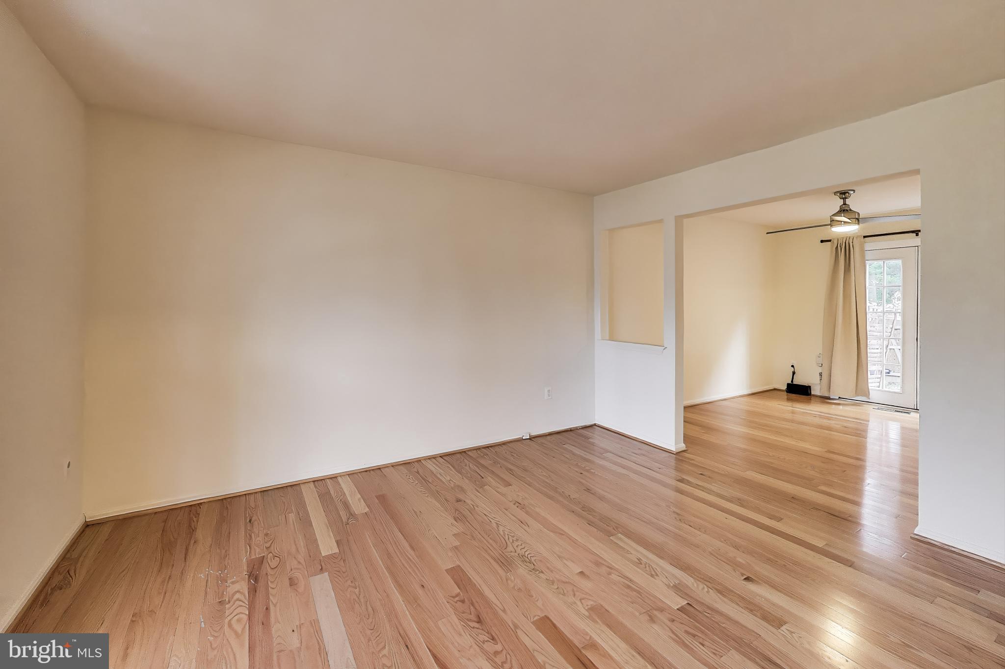 16 Tabiona Court Silver Spring, MD 20906 - Photo 4 of 34 a view of empty room with wooden floor and fan