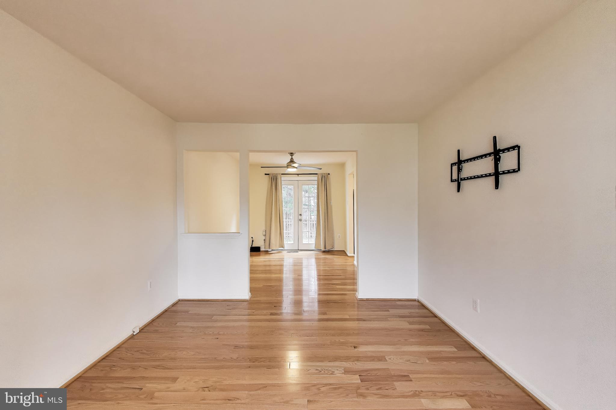 16 Tabiona Court Silver Spring, MD 20906 - Photo 5 of 34 a view of empty room with wooden floor and fan