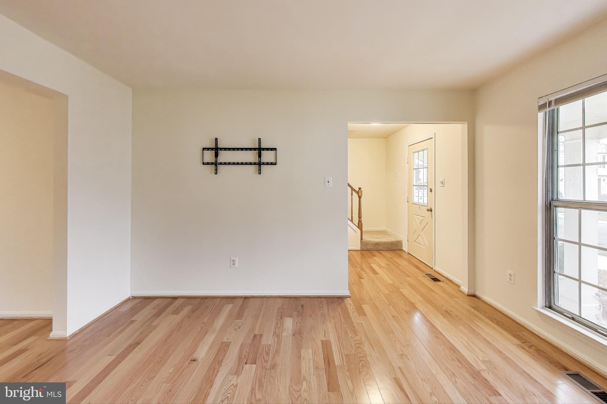 16 Tabiona Court Silver Spring, MD 20906 - Photo 6 of 34 an empty room with wooden floor and windows