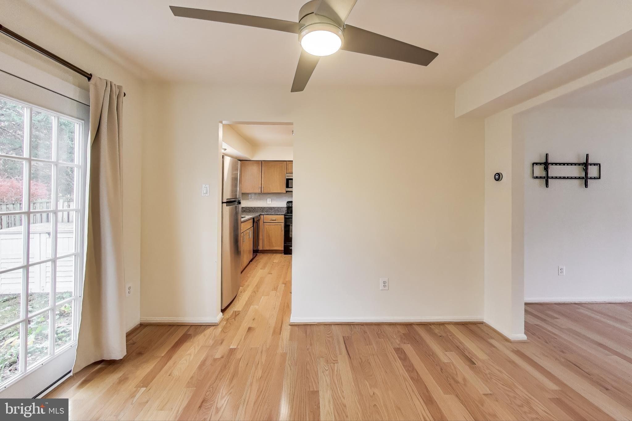16 Tabiona Court Silver Spring, MD 20906 - Photo 8 of 34 a view of empty room with wooden floor and fan