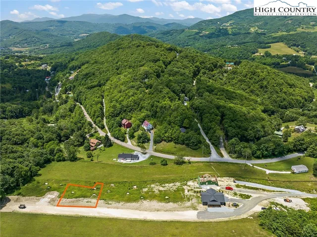 a view of a golf course with a lake