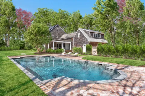 a view of a house with swimming pool and a yard