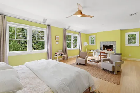 a bedroom with a bed and a couch