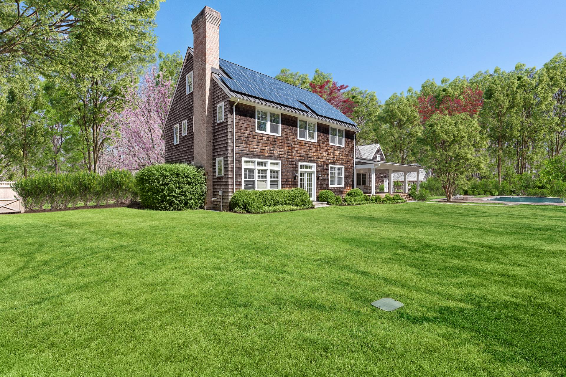 27 Gardiners Path Sag Harbor, NY 11963 - Photo 26 of 27 a front view of a house with garden and trees