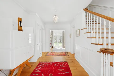 a view of a hallway with windows