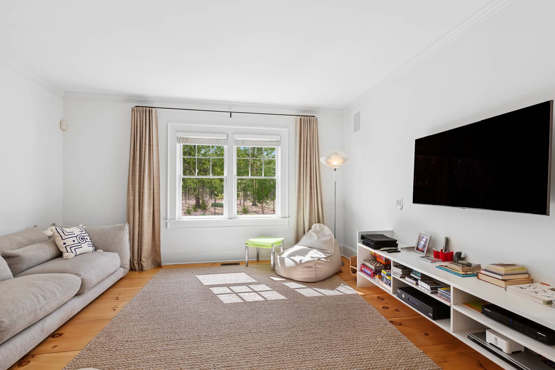 27 Gardiners Path Sag Harbor, NY 11963 - Photo 8 of 27 a living room with furniture and a flat screen tv