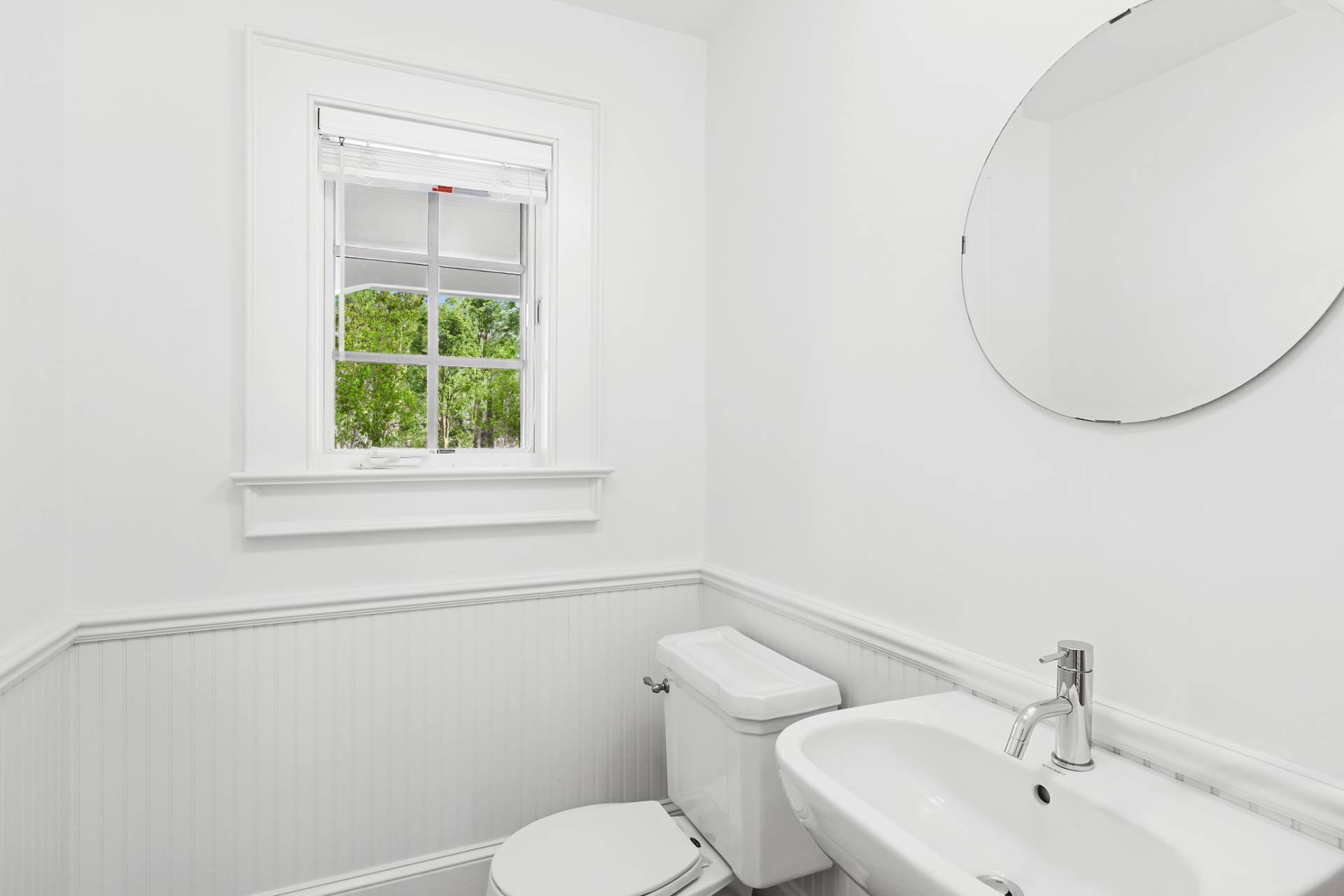 27 Gardiners Path Sag Harbor, NY 11963 - Photo 9 of 27 a bathroom with a toilet sink and mirror