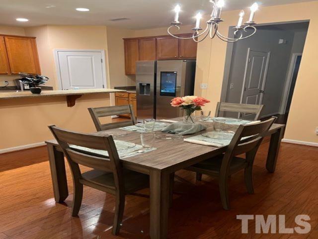 3532 Eastern Branch Road Raleigh, NC 27610 - Photo 12 of 36 a view of a dining room with furniture and wooden floor