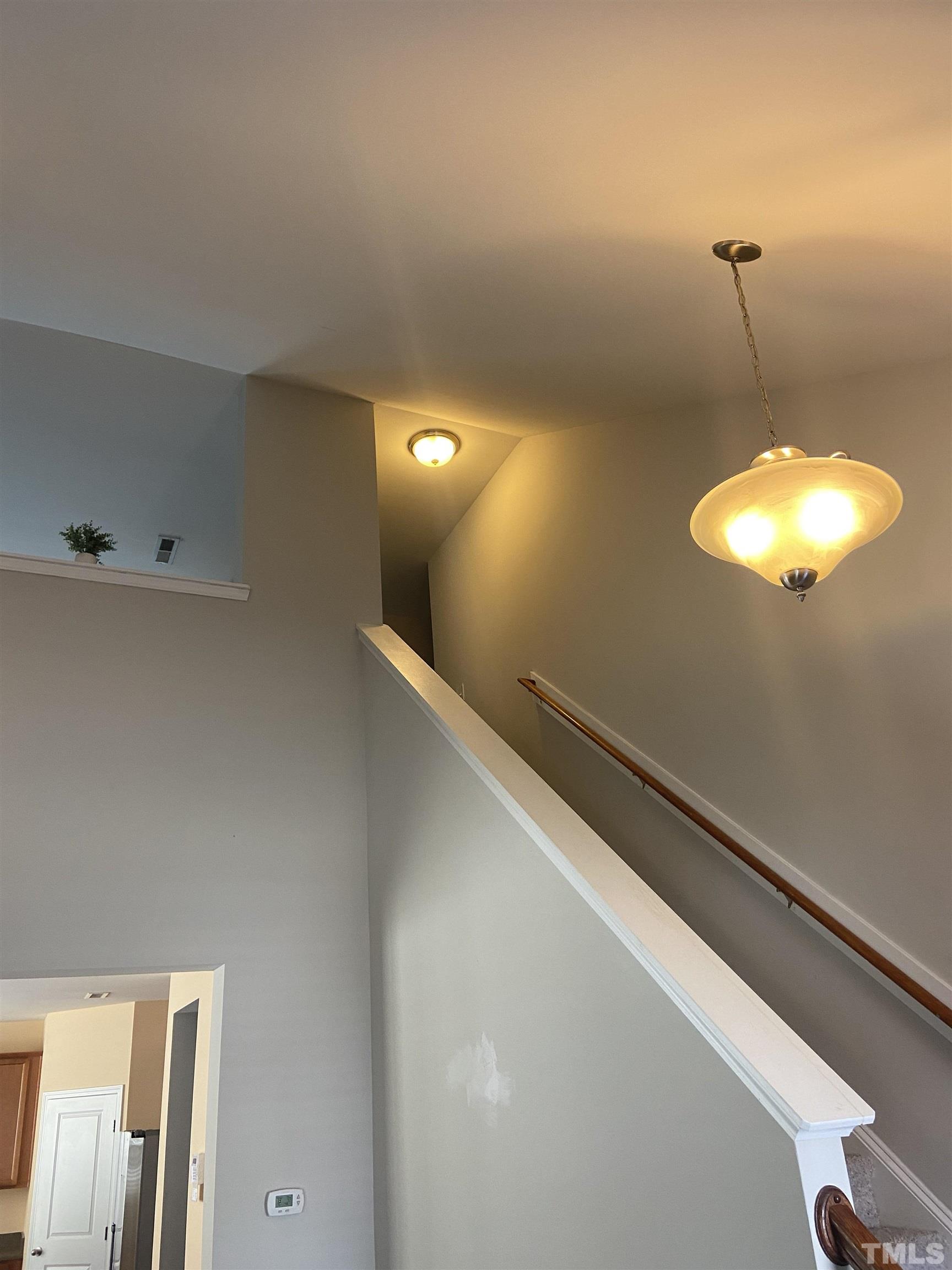 3532 Eastern Branch Road Raleigh, NC 27610 - Photo 6 of 36 a view of a hallway with a chandelier