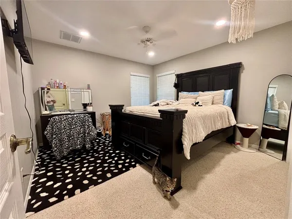 a bedroom with double bed and a window
