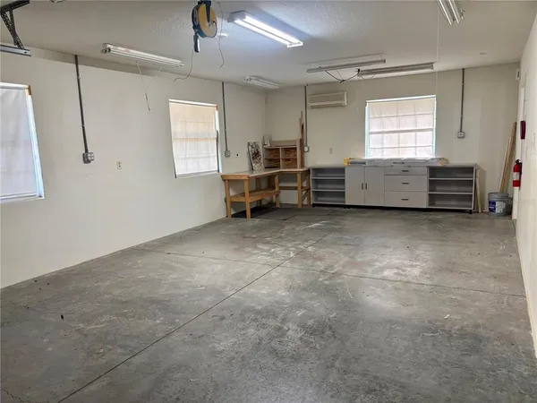 a view of a livingroom with furniture and a window