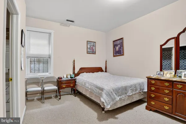 a bed room with a bed and a television