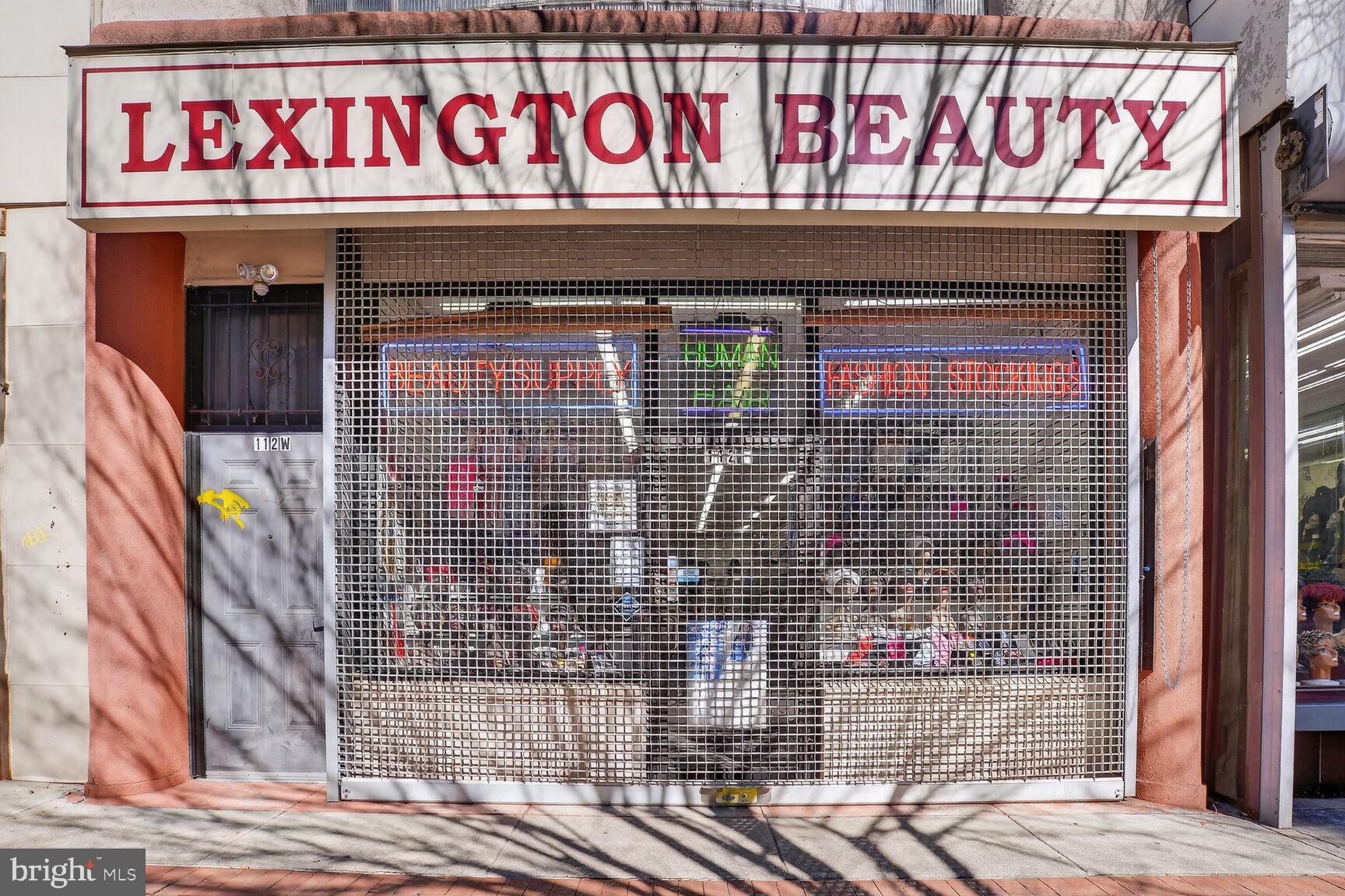 112 West Lexington Street Baltimore, MD 21201 - Photo 2 of 22 a front view of a building with retail shop