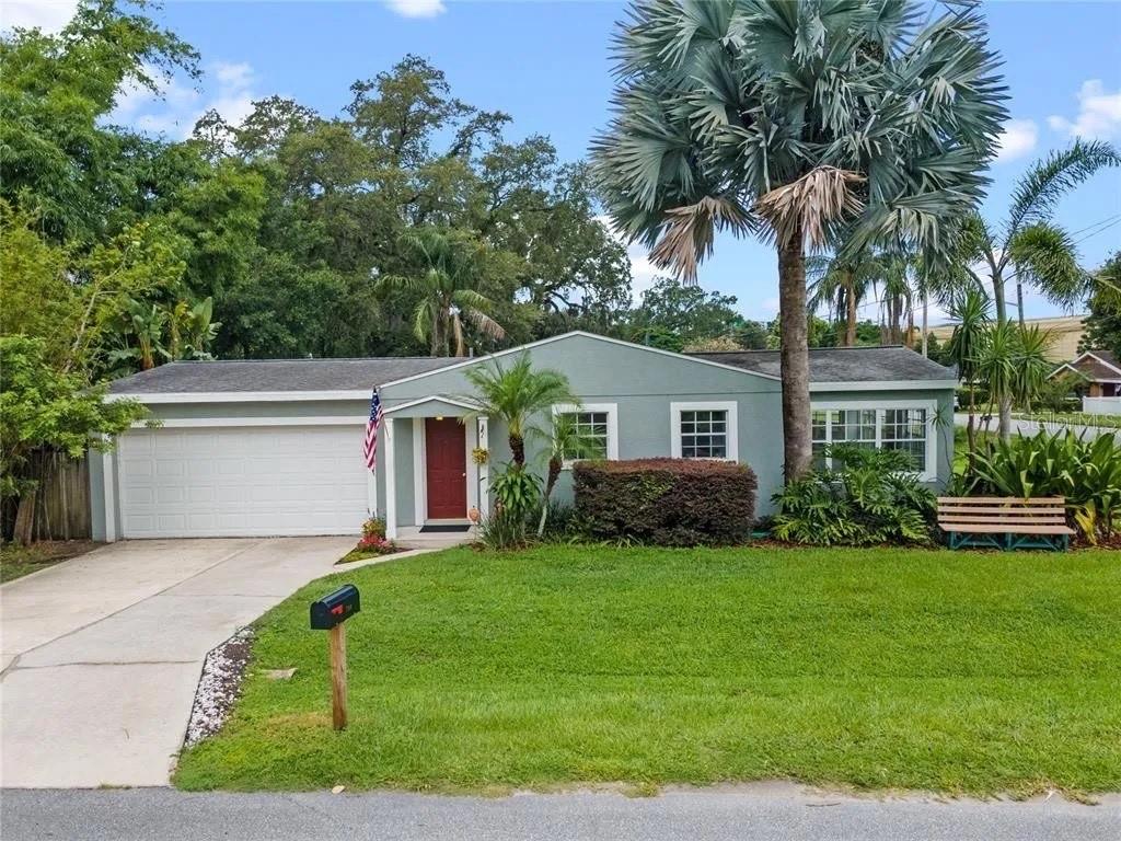 a front view of house with yard and green space