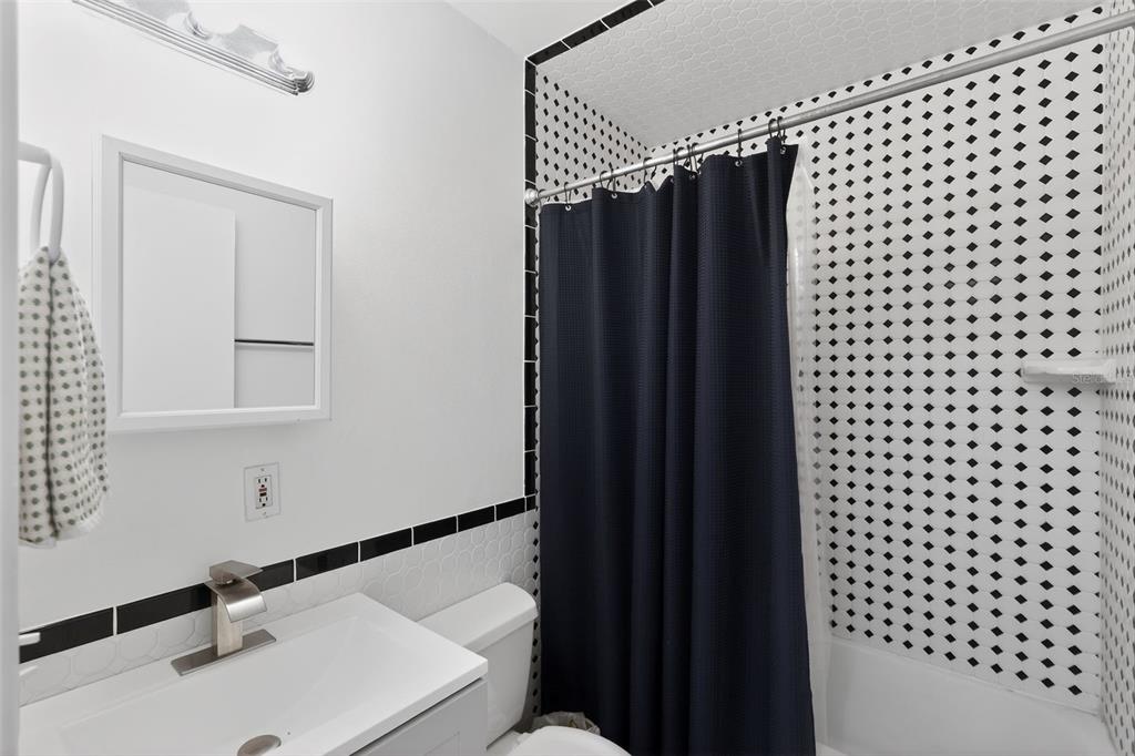 700 28th Street Orlando, FL 32805 - Photo 13 of 19 a bathroom with a sink and a mirror