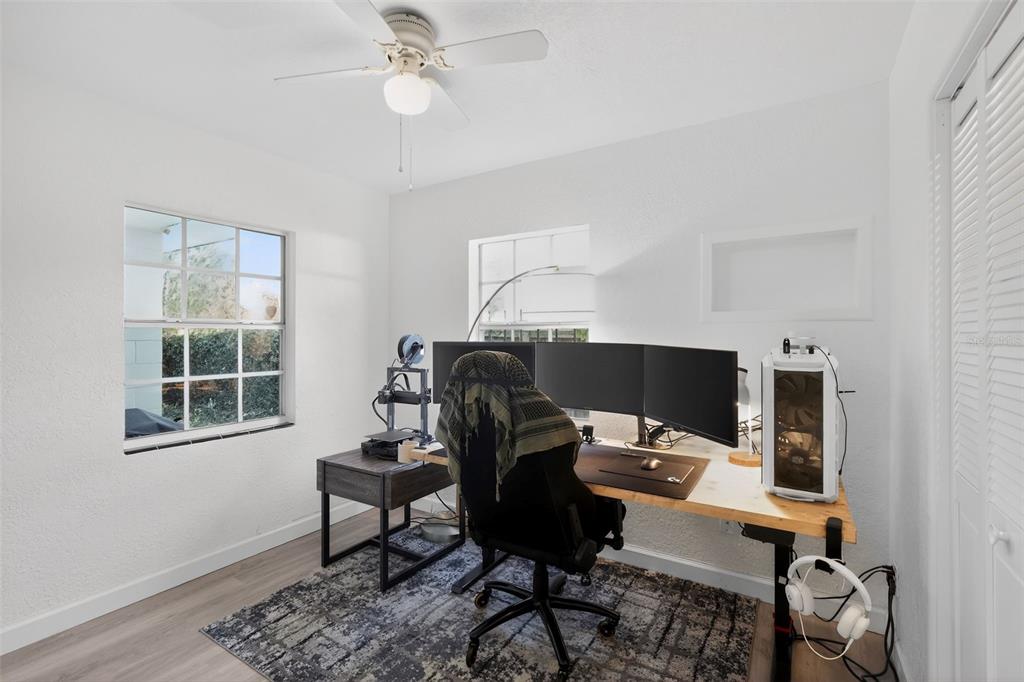 700 28th Street Orlando, FL 32805 - Photo 14 of 19 a view of a workspace with furniture and a window