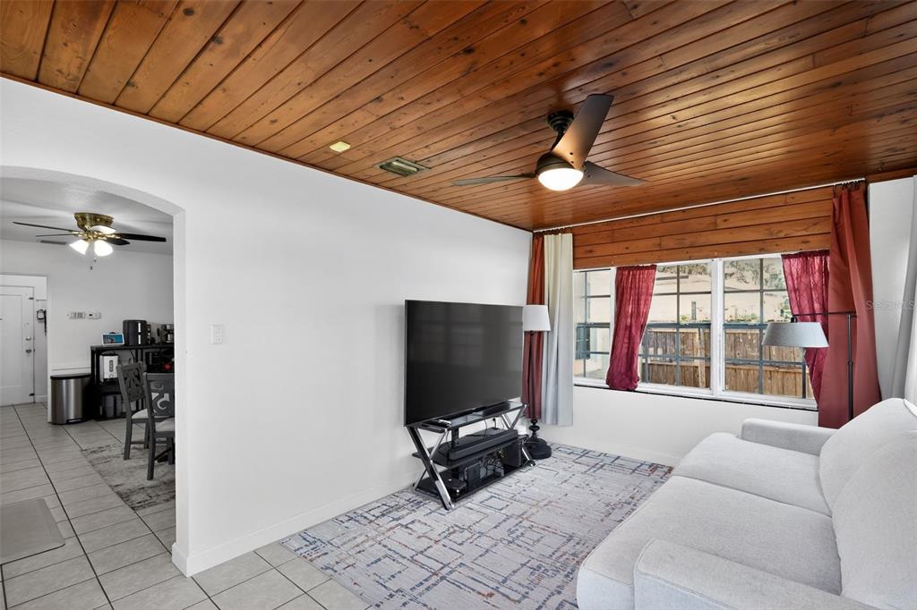 700 28th Street Orlando, FL 32805 - Photo 7 of 19 a living room with furniture and a flat screen tv