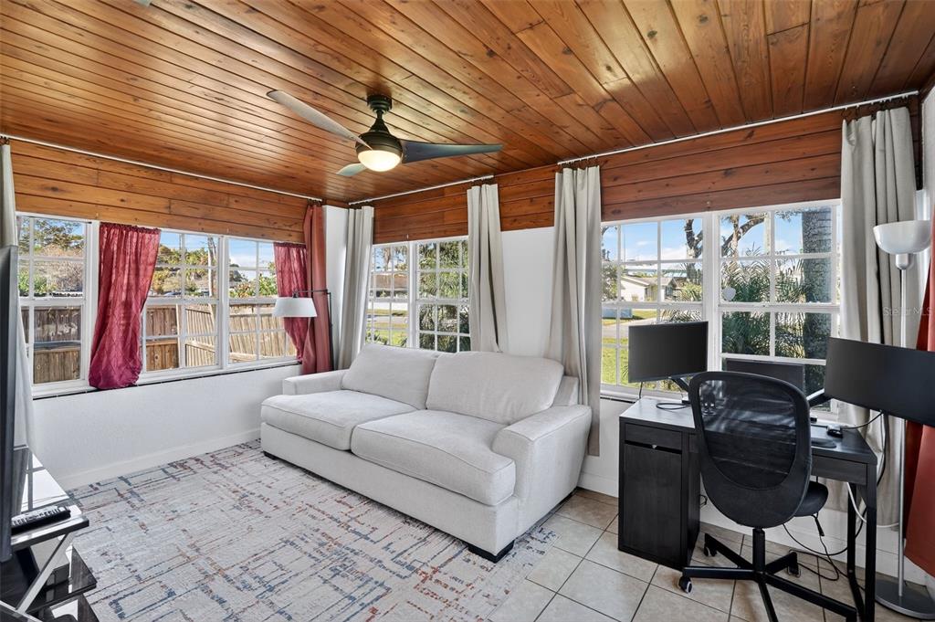 700 28th Street Orlando, FL 32805 - Photo 8 of 19 a living room with furniture and a floor to ceiling window