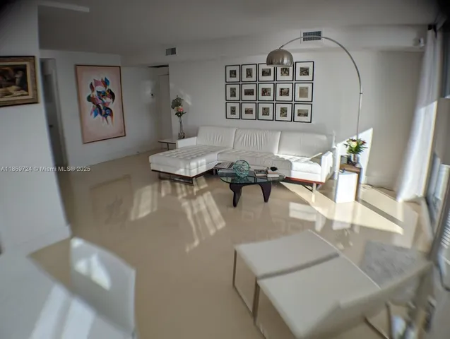 a dining room with furniture and a potted plant