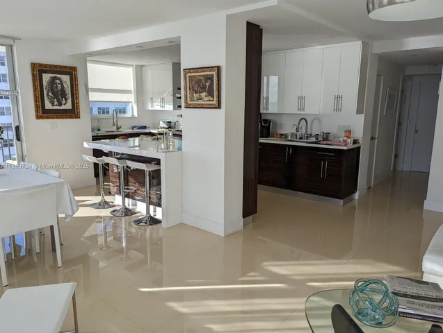 a kitchen with cabinets and window