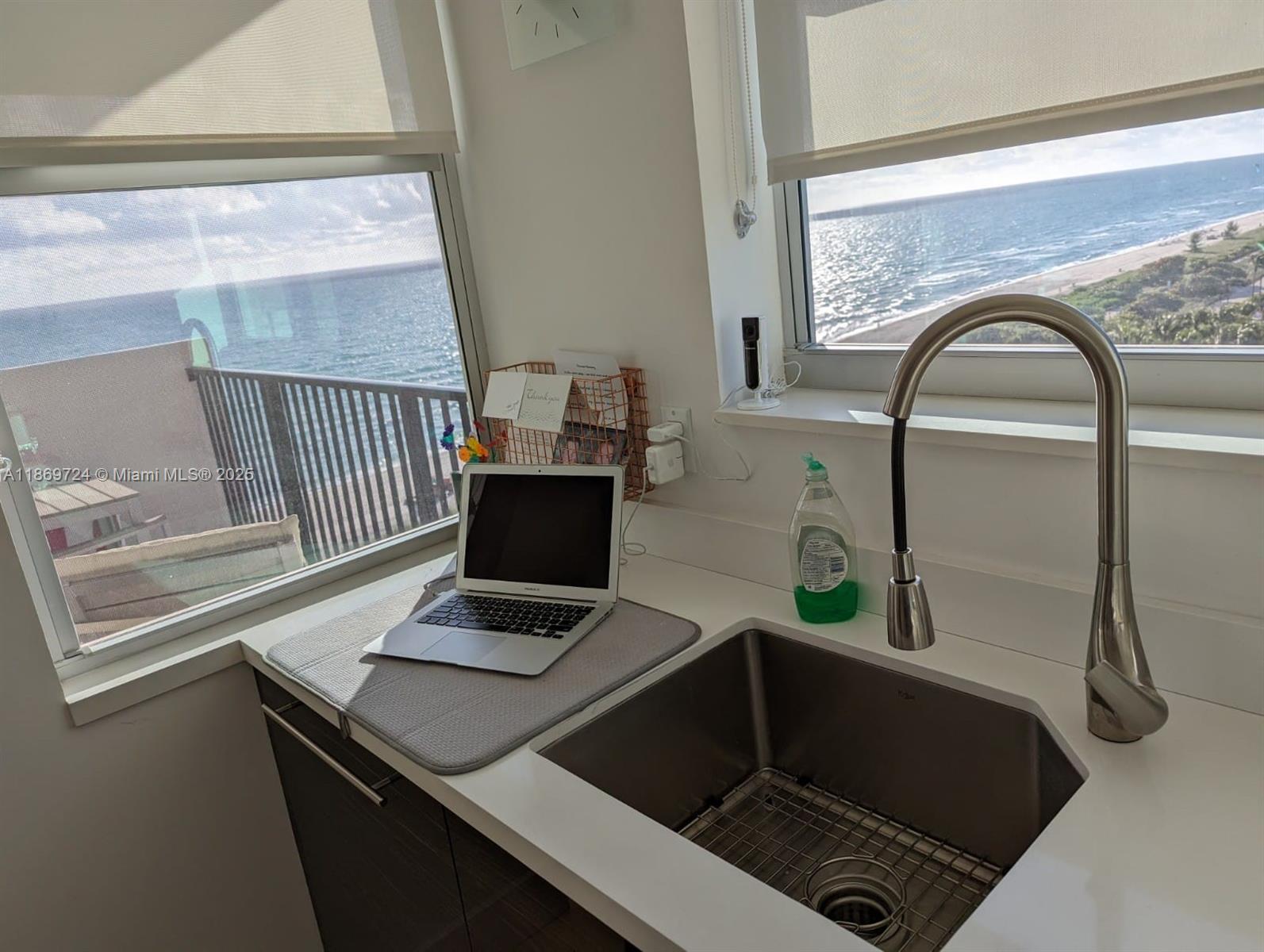 9273 Collins Avenue, Unit 1004 Surfside, FL 33154 - Photo 18 of 27 a view of utility room with a sink