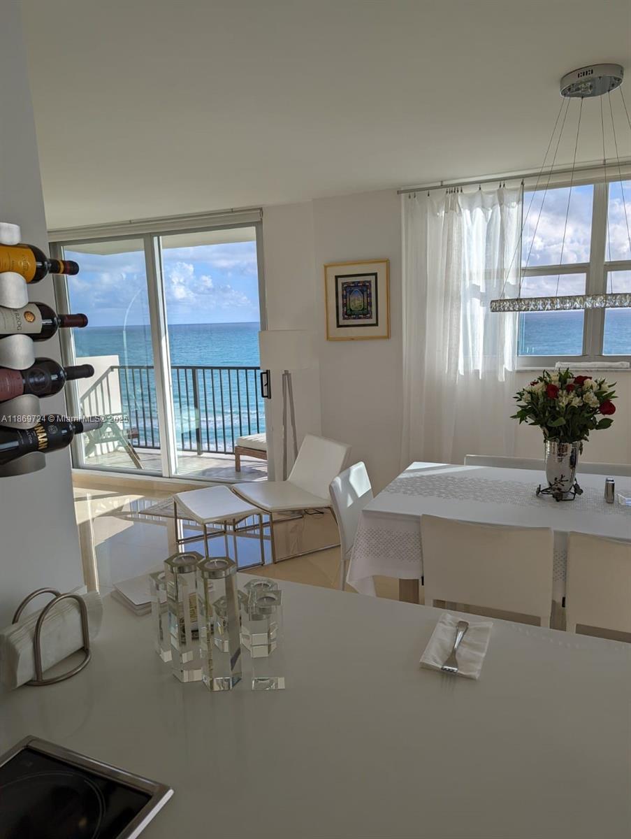 9273 Collins Avenue, Unit 1004 Surfside, FL 33154 - Photo 19 of 27 a living room with furniture and window