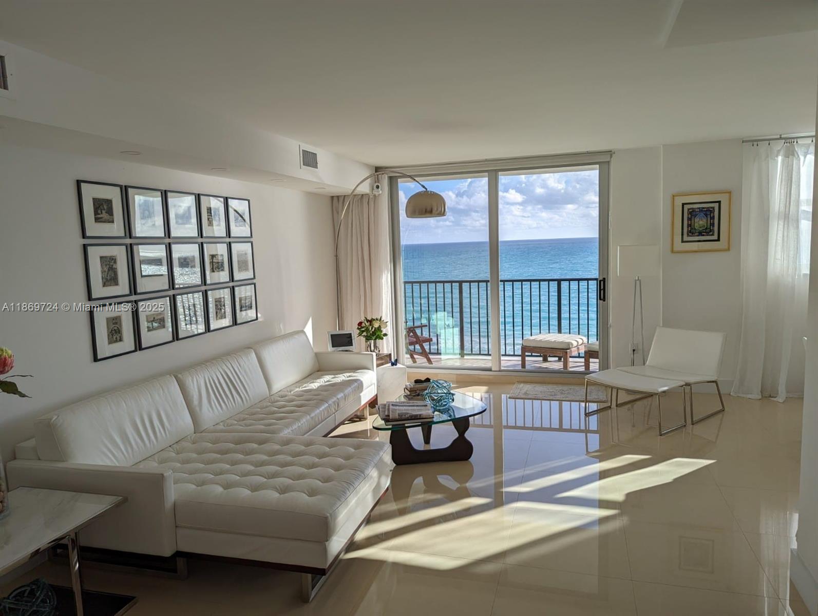 9273 Collins Avenue, Unit 1004 Surfside, FL 33154 - Photo 20 of 27 a living room with furniture and a window
